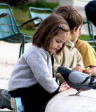 France -- kids feeding the pigeons in Paris