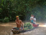 A family, their canoe and bananas