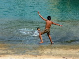 Boys playing in the harbor in Neiafu