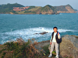 Sze Long in front of the cliff