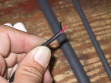 Insulation pulls off to reveal two conductors and a drain wire (shield).  Strip the two inner wires with strippers.