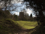 Clavering church across the castle earthworks