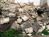 the wall of stones has been partially disassembled