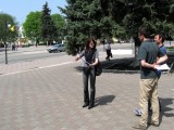 Marla relates her family's experiences in town to the French TV reporters...