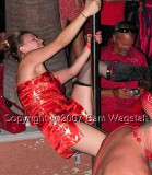 She is having fun during her pole dance.