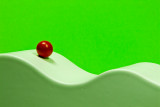 The white path of the red ball