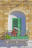 on balcony with green shutters.jpg