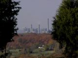 The power plant is about 5 miles away. The white brick house is about 1 mile.
