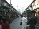 Admiring the wares, antique market, Shanghai
