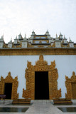 Decorated doors outside of the monastery.  The monastery is made of stucco.