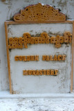 Sign for the Golden Palace Monastery which was originally part of the royal palace at Amarapura and later moved to Mandalay.