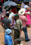 Another group of people and a man with a megaphone.