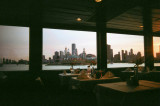 This is the dining area on the Mystic Blue with a skyline view through the windows.