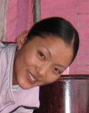 Kunming - Tibetan girl making Yak-milk tea