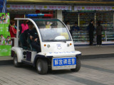 Chongqing - golf cart police (notice, shes pulling her gun)