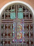 Stained glass through the gate of a tomb