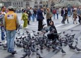 People and pigeons in Piazza del Duomo, Milans central square