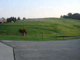 From the church parking lot across the street.  The brown area that was just hayed is right where our house will be.