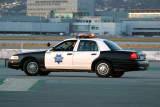 An alert SFPD officer slowly cruises in front of the A-380.