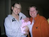 Leslie and Tisha holding baby Eva