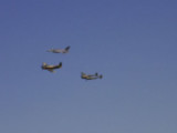 I know... blurry... its hard to get those guys... three military planes in formation in a flyby to honor the military.
