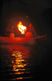 The lights of fire  attract the fish then the Cormorants start their diving and catch
