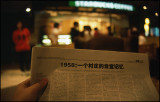 reading newspaper in starbucks in shanghai
