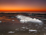 Écume de mer et soleil couchant