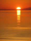 le soleil se couchant derrière Charlevoix