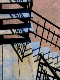 l'escalier et sa rampe noire