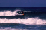 Surfer riding a wave, Sigatoka
