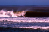 Surfer riding in a big wave, Sigatoka