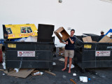 Nathalie Dumpster diving for some good boxes to mail food in.