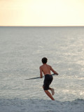 Young surfer on Florida beach