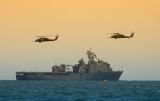 Navy destroyer and Pave Hawk helicopters