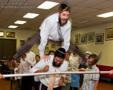 Menasha, brother of the Bar Mitzvah, leaping over older brother and the Limbo Bar