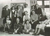 Dad's family (1945). Tim is seated with legs crossed front and center.