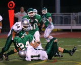 Setons Garrett Lubuiewske gets tackled by Newfields Dillon Shults and Blake Allen after making a good run