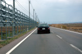 TALL snow fence on left