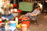 Street vendor taking a nap, Saigon