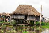 Typical Ganvi thatched hut built on stilts, Lac Nakou, Bnin