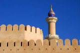 Minaret over the walls to old town Nizwa