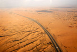 Emirates Road passing through the desert behind Umm al Quwain