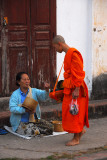 Monk receiving alms