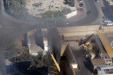 More firefighters with a hose on the adjacent tower