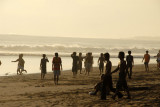 Local Balinese guys playing soccer on Seminyak Beach, Bali