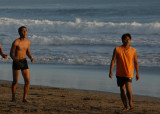 Balinese guys playing soccer around sunset, Seminyak Beach