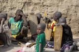 The pupils study Koranic verses written on wooden tablets