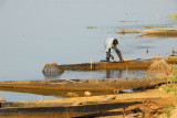 Man tending his boat, Mali