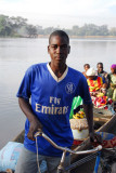 Pirogue ferryman (Nomory Sow from Babaroto, Mali) in a Fly Emirates shirt